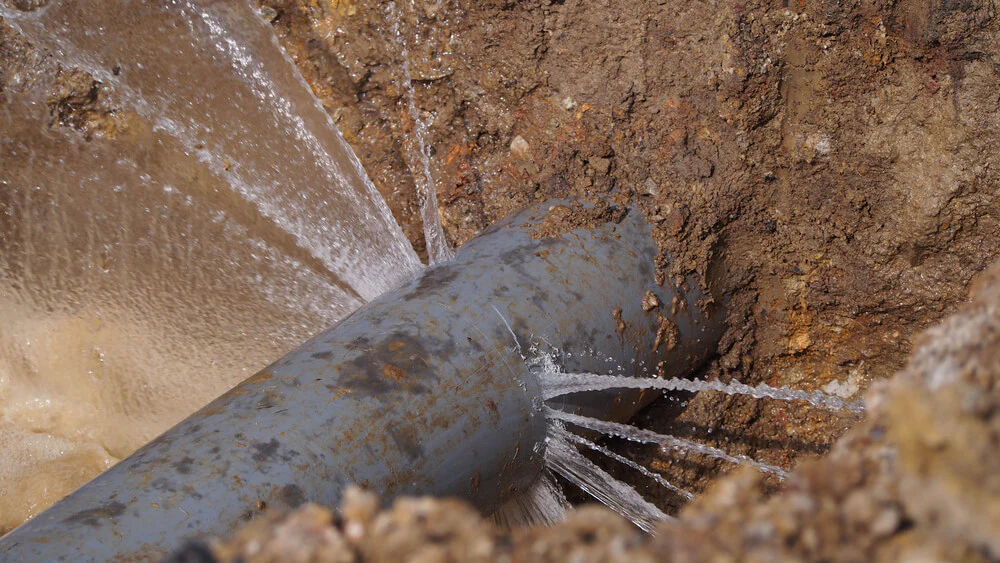 High-pressure underground pipe leak pinpointed by a plumbing leak detection specialist before beginning repairs
